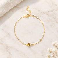 Bracelet doré à rose et cœur