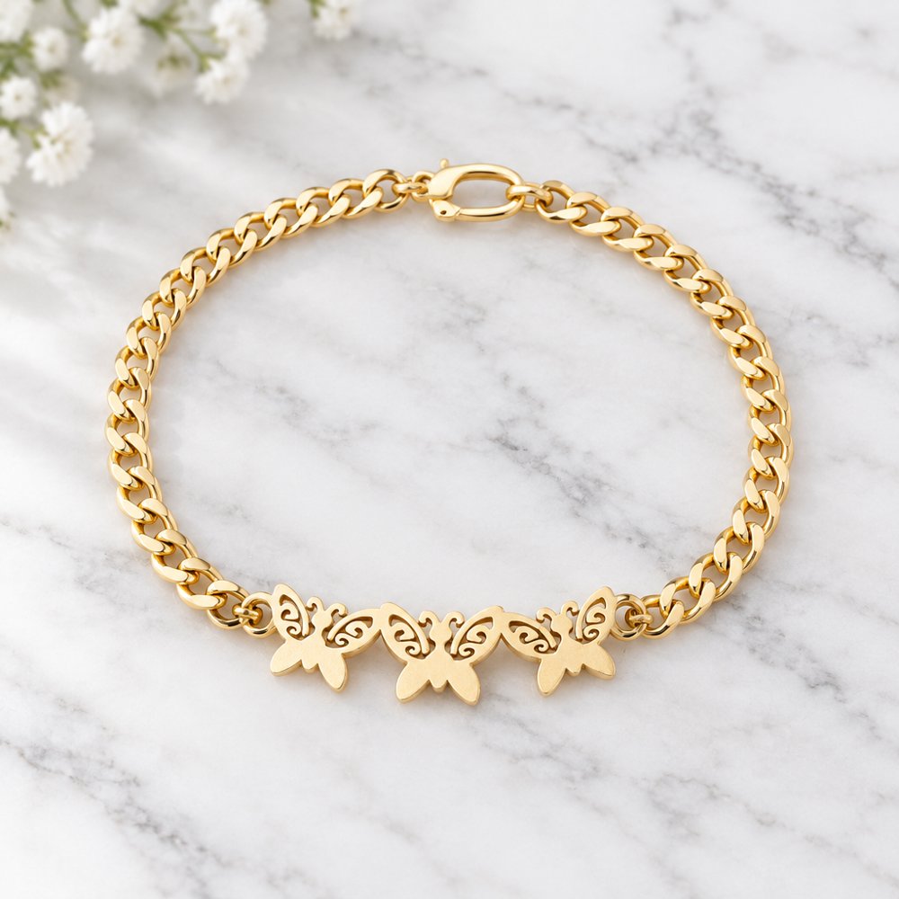 Bracelet papillons doré, un des bijoux offerts au choix Image